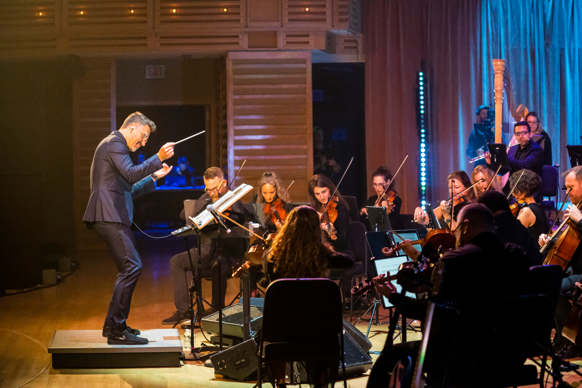 Conductor leading Nu Deco Ensemble during the Allen Stone and Derrick Hodge concert, April 2023