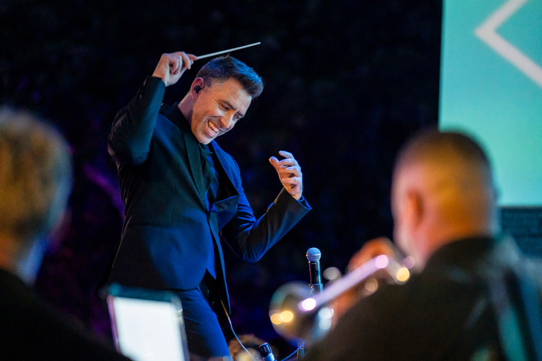 Conductor Jacomo Bairos laughing while conducting Nu Deco Ensemble with Betty Who, January 2025