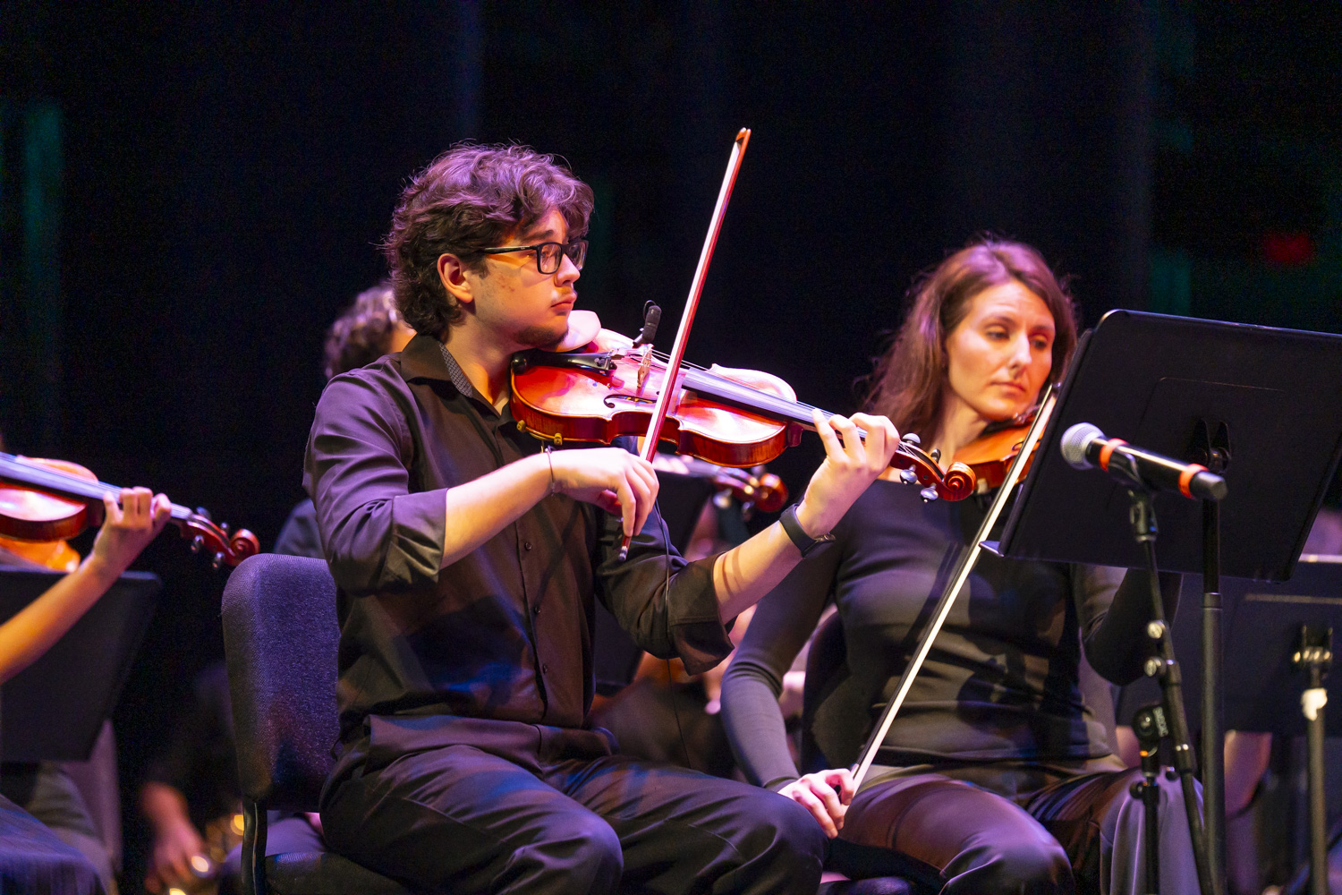 NXT violinist Arturo Estevez performing with the Writers Cohort 2026